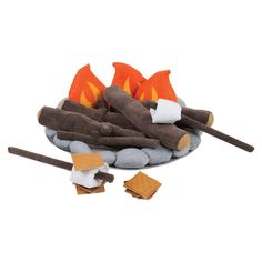 a fire pit filled with marshmallows and sticks