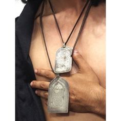 Size Approx. 2 7/8" x 1 5/8" (smaller top amulet) Size Approx. 3 5/8" x 2" (larger bottom amulet) Top amulet is engraved with a Star of David atop a magic square, a common protective gesture among Berber. Bottom Amulet is engraved with a Hand above a Seal/Shield for protection. Smaller Amulet is .950 Silver by acid assay. Larger Amulet is .925 Silver by acid assay. Made in Morocco, mid-20th Century. Magic Squares, A Seal, Star Of David, Amulets, Small Tops, Overwatch, Dog Tag Necklace, Morocco, 20th Century