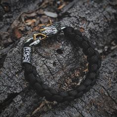 Introducing our exclusive Fenrir Wolf Paracord Bracelet, a stunning piece of Viking-inspired jewelry. This striking bracelet seamlessly merges ancient Viking aesthetics with modern durability. Crafted with utmost precision and quality, each detail honors the strength and resilience of the Vikings. More than just an accessory, it’s a testament to their enduring legacy, making it a cherished addition to any collection. Specifications: Length: 19 cm, 21 cm, 23 cm Bead Material: Metal, Stainless Steel Bracelet Material: Black Paracord Rope Material: Premium 316L Stainless Steel Warranty: Lifetime Warranty Shipping: Worldwide Shipping Serpent Dragon, Nordic Symbols, Fenrir Wolf, Paracord Rope, World Serpent, Nordic Runes, Mjolnir Pendant, Viking Shield, Ancient Vikings