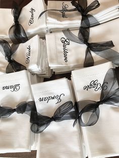 several napkins with black ribbons tied around them