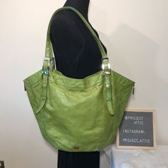 Kooba "Blake Tote" In Lime Green From The 2007-08 Kooba Collection Is An Extra Large Hobo Bag In Retro 1980s Chic Style. Very Classic Hobo With Pop-Out Edges Trimmed With Silvertone Zippers Down The Side. Supple, Lightweight, Distressed Patent Leather. Exterior And Trim. Edgy Grommets In The Double Handles Allow You To Raise And Lower The Strap Drop. Silvertone Kooba Plate On The Front And Interior. Interior Zipper Pocket And Two Slip Pockets; Bag Lined In Brown Satin Fabric. Attached Key Fob. H Modern Green Shoulder Bag With Silver-tone Hardware, Green Shoulder Bag With Palladium Hardware, Green Shoulder Bag With Palladium Hardware For Shopping, Green Shoulder Bag With Palladium Hardware And Double Handle, Green Shoulder Bag With Double Handle And Palladium Hardware, Green Bags With Silver-tone Hardware And Double Handle, Green Shoulder Bag With Palladium Hardware For Everyday, Designer Hobo Bag With Silver-tone Hardware For Everyday, Green Tote Shoulder Bag With Palladium Hardware