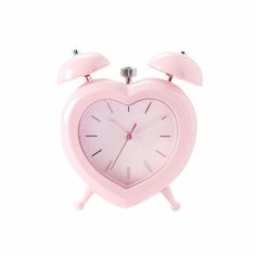 a pink alarm clock with two bells on the front and back of it's face