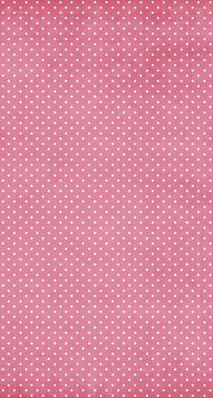 a pink and white polka dot fabric with small white dots on the top, it is very