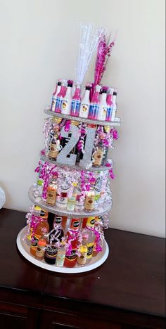 this is an image of a table with bottles on it and the number four in pink