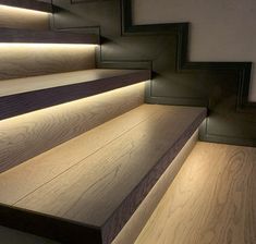 some stairs with lights on them in a room