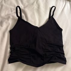 Free People Movement Top Athletic, Supportive Top Cropped With Corset Like Rouging Detail Black Spaghetti Straps - Not Adjustable Never Worn - New Condition Size Xs/S Black Ruched Tank Top For Party, Black Ruched Tank Top For Summer, Casual Bra Friendly Top For Night Out, Casual Black Ruched Tank Top, Black Ruched Cami Top, Casual Black Crop Top With Built-in Bra, Black Cotton Bra-friendly Crop Top, Black Cotton Bra Friendly Crop Top, Bra Friendly Black Cotton Crop Top