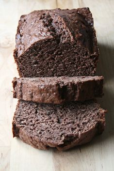 three slices of chocolate cake sitting on top of each other