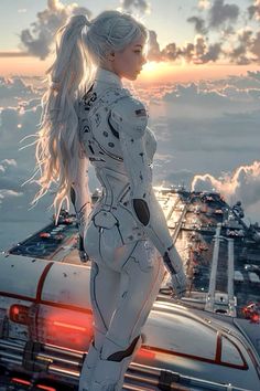 a woman dressed in white standing on top of a building next to a car and clouds