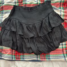 I’ve Never Worn It Casual Black Skort For Vacation, Chic Black Skort With Elastic Waistband, Black Ruffled Bottoms For Vacation, Black Skort For Spring Vacation, Casual Ruffled Skirt For Night Out, Black Flowy Bottoms For Day Out, Casual Black Skirt For Brunch, Black Tiered Skirt For Vacation, Black Lined Skort For Vacation