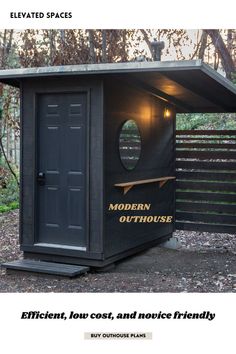 a small outhouse in the middle of a wooded area