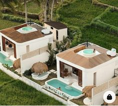 an aerial view of two houses with hot tubs