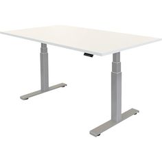 a white table sitting on top of a metal stand up desk with one leg raised