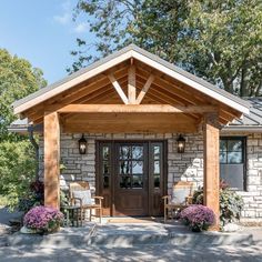 the front entrance to a home with chairs and tables