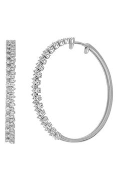 A stunning array of 108 round-cut diamonds enchants the curve of these dreamy hoop earrings handcrafted from 18-karat white gold. 1 3/8" hoop diameter Total diamond weight: 1.10ct. Color: G Clarity: VS 18k gold/diamond Imported >Diamond Guide Platinum Hoop Jewelry With Single Cut Diamonds, Elegant Platinum Hoop Earrings With Single Cut Diamonds, Dazzling Hoop Earrings With Single Cut Diamonds For Wedding, Formal Platinum Hoop Earrings With Single Cut Diamonds, Hoop Earrings With Single Cut Cubic Zirconia, White Gold Hoop Earrings With Pave Setting In Platinum, Silver Hoop Earrings With Single Cut Diamonds For Wedding, Fine Jewelry Hoop Earrings With Sparkling Stones For Anniversary, Anniversary Hoop Earrings With Sparkling Stones