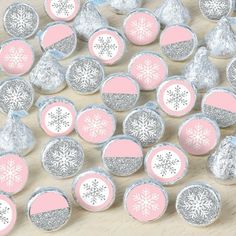 pink and silver snowflake candy wrappers on a table