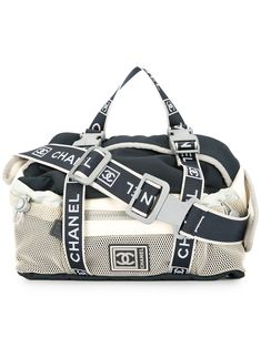 Chanel’s Sports Line combines minimalist sophistication, practical materials and outstanding design. Made from practical white and navy blue nylon, this belt bag is versatile and casual. With a detachable top handle and an adjustable strap, it features a top zip closure, a main internal compartment, an internal logo patch, a front zip compartment, a front logo patch and a drawstring line. Please note that pre-owned items are not new and therefore might have minor imperfections. This item comes with original Chanel authenticity card. Sporty Nylon Bag With Logo Patch, Nylon Shoulder Bag With Logo Patch For Travel, Chanel Luggage, Cross Body Fanny Pack, Vintage Sport, Accessories Bags Shoes, Pink Chanel, Shopping Chanel, Leather Belt Bag