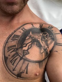 a man with a clock tattoo on his chest