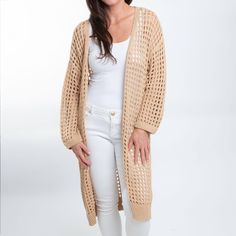 Beat the chill in style with the Enya Long Crochet Cardigan. Featuring a trendy neutral sepia tone with an open crochet detail, this cardigan is easy to wear and certain to become your spring go-to. This long sleeve sweater is perfect for your Spring and Summer wardrobe, throw over your favorite top with a pair of leggings or skinny jeans with some sandals and necklace for a classic look! This top is a light weight sweater, it will give you enough warmth and comfort in a cool day without looking Crochet Boho Cardigan, Long Crochet Cardigan, Boho Cardigan, Crochet Boho, Boho Crochet, Crochet Details, Crochet Cardigan, Light Weight Sweater, Summer Wardrobe