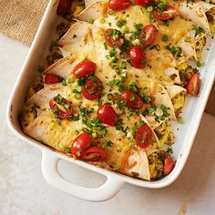 an enchilada dish with tomatoes and onions in a casserole dish