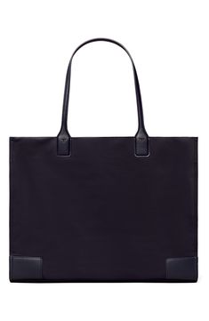 A classic tote made from durable nylon with a stacked-T logo in faux leather is that perfect accessory for your on-the-go style. 17.3”W x 13.2”H x 5.2”D   Structured silhouette with flat base for stability   Recycled polyester lining   Recycled nylon   Imported Elegant Nylon Tote Bag, Business Nylon Tote Bag, Designer Everyday Nylon Bag, Classic Nylon Shoulder Bag With Double Handle, Classic Nylon Bags With Leather Trim, Classic Nylon Bag With Leather Trim, Classic Everyday Nylon Shoulder Bag, Classic Nylon Shopping Bags, Classic Nylon Shoulder Bag For Everyday