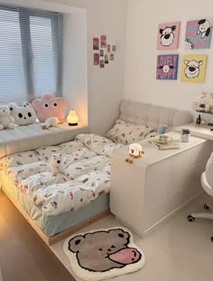 a bed room with a neatly made bed next to a white desk and computer chair