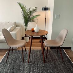 two chairs and a table in a room