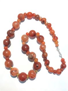 A beautiful 900 years old Pre Ankur carnelian beads necklace from Cambodia, worn by royals at that time as a luck charm. agate beads as counters. In great condition and colors of the beads are exceptional with great shine on its surface as its been continuesly used since then till now. Carnelian Beaded Necklaces With Gemstone Beads, Carnelian Beaded Necklaces With Polished Round Beads, Round Carnelian Beaded Necklaces With Polished Beads, Orange Carnelian Beaded Necklaces With Large Beads, Carnelian Beaded Necklaces With Large Round Beads, Orange Carnelian Beaded Necklaces With Polished Beads, Carnelian Beaded Necklace With Polished Round Beads, Orange Carnelian Beaded Necklaces With Round Beads, Carnelian Gemstone Beads Necklace