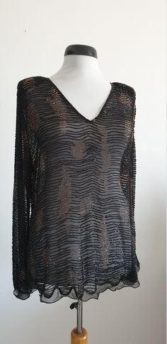 "Vintage 1970s black sheer silk chiffon blouse with bronze and black beading, long sleeves, slight V neckline and zip the back. ✂-----Measurements : fits like: medium bust: 42\" waist:37\" sleeve:25\" length: 28 1/2\" shoulder: 17\" brand/maker: n/a condition: excellent Shipping Is Avaliable Worldwide. Every item is carefully shipped Priority via Air Mail - shipping takes from 7 to 14 working days, depending on your location. Shipping includes Tracking. Come and check out our shop to see all ite Silk Chiffon Blouse, Black Silk Blouse, Velvet Vest, Dresses 40s, 1940s Dresses, Chiffon Blouse, Lace Blouse, Polka Dot Dress, Black Silk