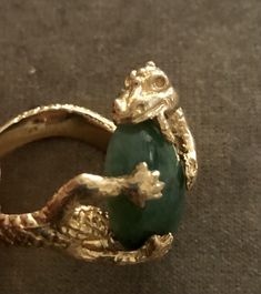 "Vintage Estate 14K 16.3 g Dragon Eating Green Jade Ring. Size: 9. Jade- 3/4\"x1/2\". Markings: 14K ( Ring was resized so the mark have been partially erased but still show partial markings). Amazing large piece. Dragon represent luck. Dragon eating jade signifies abundant wealth, luck and good health attained. Beautiful Details. Sold as is. Pre- Owned." Unique Green Emerald 14k Gold Ring, Unique 14k Gold Green Emerald Ring, Unique Green Emerald Ring In 14k Gold, Unique 14k Gold Emerald Ring, Collectible Yellow Gold May Birthstone Ring, Unique Hallmarked Emerald Ring, Collectible May Birthstone Yellow Gold Ring, Yellow Gold May Birthstone Collectible Ring, Rare Collectible 14k Gold Jewelry