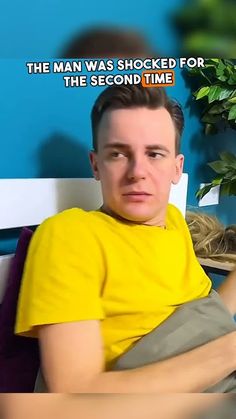 a man sitting on top of a bed next to a potted plant and text that reads, the man was shocked for the second time