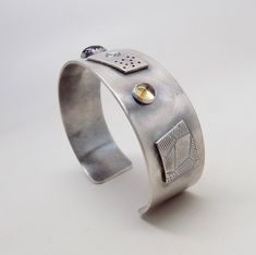 "Awesome sterling silver cuff bracelet. I formed the cuff from 18gage heavy sterling silver. A 8mm by 10 mm amethyst is at the center and 6mm garnet and 6mm citron gem stones at each side. The cuff is 3/4\"wide by 6 \" .All my jewelry come in a nice gift box." Sterling Silver Polished Cuff Bracelet, Sterling Silver Open Cuff Bangle For Gift, Sterling Silver Open Cuff Bangle As A Gift, Sterling Silver Polished Cuff Jewelry, Sterling Silver Cuff Bracelets For Anniversary, Silver Sterling Silver Cuff Bracelet For Anniversary, Modern Sterling Silver Cuff Jewelry, Modern Silver Bracelets With Gemstones, Silver Open Cuff Bracelet For Gift