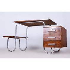 a wooden desk with two drawers on wheels