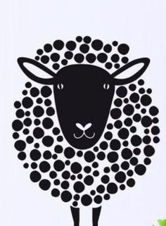 a black and white sheep with lots of dots on it