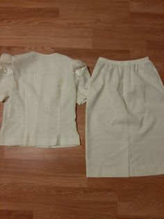 "Vintage Linen Look Rayon/Polyester 2 Piece Ivory/Cream Pencil Skirt/Short Sleeve Blouse/Jacket Leslie Fay Petite Formal Occasion Dress/Suit Size 8 But May Also Fit Size 10. Excellent Vintage Condition. No Rips, Tears Or Stains Dress Form Measurements 35-27-36 Made By Leslie Fay. Marked Size 8 Petite. Rayon/Polyester/Cotton. Union Garment Tag. Machine Washable Elastic Waist Pencil Skirt Below Knee Length 6.5\" Vent In Back Short Puffy Sleeves With Shoulder Pads Ivory Decorative Embroidery Trim B Fitted Pencil Skirt For Wedding, Elegant Skirt Sets For Spring, Vintage Beige Sets For Spring, Vintage Beige Party Skirt, Elegant Off White Sets For Spring, Elegant Off White Summer Sets, Elegant Fitted Skirt Set For Wedding, Vintage White Sets For Summer, Elegant Cream Short Sleeve Sets