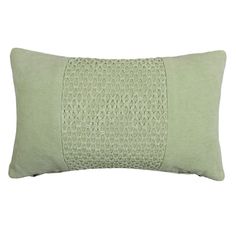 a light green pillow with an embroidered design on the front and side, along with a white background