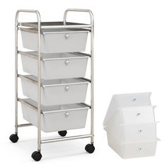 a metal cart with four white baskets on it and a plastic container next to it