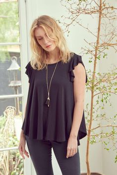 Make a statement with the Ruffle Riot Ruffle Sleeve Top! This top adds a feminine flair to any outfit, featuring classic A-line cut with a hint of ruffle sleeves. Wear it with flares or jeans for a stylish look that won't go unnoticed. Take the plunge and show off your chic vibe! 96% Viscose 4% Spandex Made in USA Relaxed fit Stretchy Raw edges Lightweight draped top Slight high-low hem ** Approx measurements listed below are of the actual clothing item laid flat ** :: Top stretches an additiona Dress Layer, Ruffle Sleeve Top, Draped Top, Elegant Drapes, Swimwear Sets, Ruffled Sleeve Top, Flowy Tops, Ruffle Top, Sleeve Detail