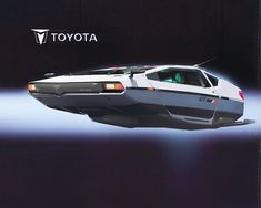 a futuristic car flying through the air in front of a toyota logo