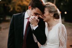 a bride and groom standing close to each other