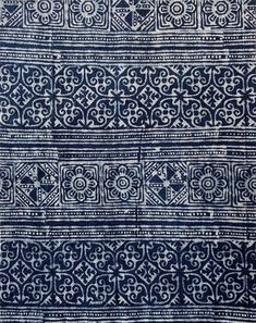 an old blue and white cloth with designs on it