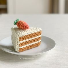 a piece of crocheted cake on a plate