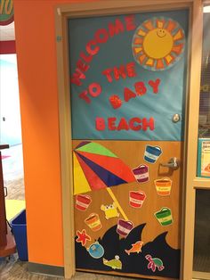 a door decorated with beach themed items and the words welcome to the baby beach on it