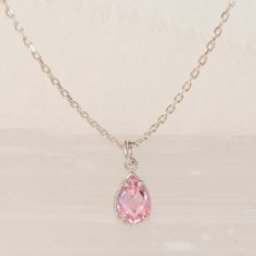 💎 A crystal pink necklace that will amaze you with its mini and 3D cut. The necklace is a great complement to other necklaces and is also stylish and elegant on its own. 💎 We offer chain lengths from 14-26 inches. You can give your custom size if you want to use it as a chooker. Suitable for 12-14 inch chooker. 💎 Also perfect for gifting to your loved ones. A gift for your mommy, sister and bestfriends to your daughter. Moreover, we make it a special gift package for you. 💎 October birthston Pink Dainty Pendant Crystal Necklace, Pink Dainty Crystal Pendant Necklace, Dainty Pink Crystal Pendant Necklace, Pink Dangle Necklaces With Gemstones, Pink Pear-shaped Gemstone Necklace, Pink Dangle Charm Necklaces, Pink Gemstone Briolette Necklace, Pink Briolette Necklace For Jewelry Making, Pink Briolette Gemstone Necklace