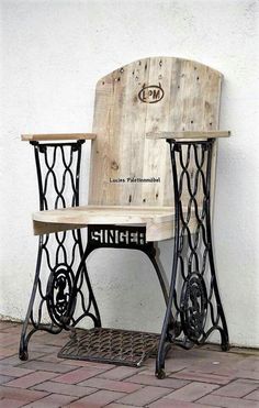 an old sewing machine turned into a table and chair for someone to sit on it