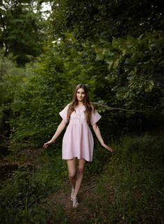 Short dress made of high quality double gauze fabric. Front fastening with 2 cocounut buttons. Short  sleeve. Side pockets.  Loose fit. Matching belt at the back. The model in Lt. Pink dress is wearing size S/36. She is 70"/178 centimeters height (bust 34"/86cm , waist 26 1/2"/68cm , hips 35 1/2"/90cm ) The model in Lt. Yellow Pudding dress Is wearing size S/36. She is 66 1/2", 169 centimeters height (bust 32,5"/83cm , waist 25"/63cm , hips 35,5"/90cm ) The model in Grape dress is wearing size S Linen Short Sleeve Mini Dress, Summer Daywear Dress With Rolled Sleeves, Summer Dresses With Rolled Sleeves For Daywear, Flowy Short Sleeve Shirt Dress, Short Sleeve Linen Dress For Beach, Flowy Short Sleeve Shirt Dress For Daywear, Summer Dresses With Short Sleeves And Buttons, Flowy Short Sleeve Shirt Dress For Summer, Linen Short Sleeve Mini Dress For Summer