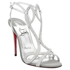 Christian Louboutin Double L Strass Crystal Glitter Sandals are set high on a striking stiletto heel and features two narrow crossed straps in a cursive L shape. Dressed in dazzling crystals, glitter and metallic leather, these sandals evoke regal elegance. CL monogram on the heels. Leather/suede/crystal upper. Round open toe. Adjustable ankle strap. Lacquered leather sole. Brand new, never worn. Comes in original packaging. Made in Italy. Luxury Silver High Heels, Red Prom Shoes, Cl Monogram, Cursive L, High Heels For Prom, Regal Elegance, Crystal Heels, Sparkly Heels, Glitter Sandals