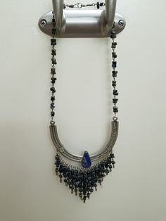 Vintage Peruvian Lapis Silver Bib Style Necklace,, lovely craftsmanship.. each stone is linked with silver wire and a nice Lapis stone inlaid in silver ornate metal is the center pieces.. shorter style necklace.. 15 inches Bohemian Lapis Lazuli Beaded Necklaces, Silver Wire Wrapped Bohemian Necklaces, Silver Wire Wrapped Bohemian Necklace, Handmade Lapis Lazuli Jewelry For Festivals, Silver Sterling Beaded Gemstone Necklace, Silver Sterling Silver Beaded Gemstone Necklace, Sterling Silver Beaded Gemstone Necklace, Silver Sterling Silver Gemstone Beaded Necklace, Antique Silver Beaded Bohemian Jewelry