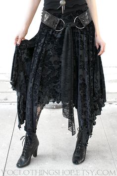 Black Gothic Velvet Bottoms, Black Velvet Gothic Bottoms, Gothic Party Bottoms With Asymmetrical Hem, Gothic Bottoms With Asymmetrical Hem For Spring, Gothic Asymmetrical Hem Bottoms For Spring, Gothic Asymmetrical Skirt For Party, Gothic Ruffled Skirt, Gothic Fitted Lace Bottoms, Gothic Black Bottoms With Asymmetrical Hem