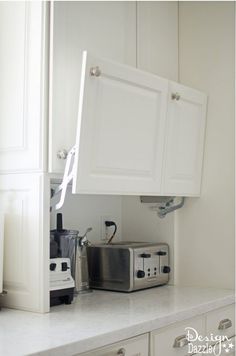 a toaster oven sitting on top of a kitchen counter next to a coffee maker