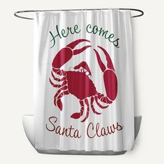 a shower curtain with a crab on it and the words here comes santa claws in red